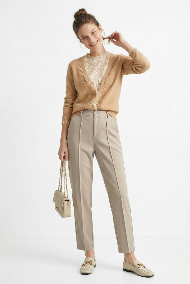 Women's wool tapered trousers by FJØRNA, stylish merino pants featuring a sleek fit and cozy wool fabric.