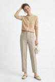 Women's Merino wool tapered trousers by FJØRNA, stylish and comfortable wool pants for women, shown in a fashionable outfit.