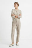 Women's Merino wool tapered trousers by FJØRNA, stylish and comfortable pants for women, shown in a casual outfit.