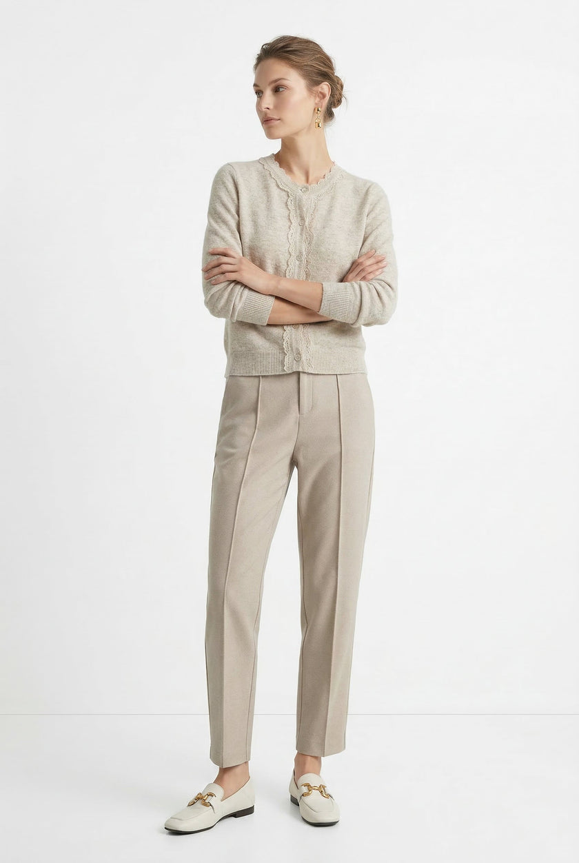 Women's Merino wool tapered trousers by FJØRNA, stylish and comfortable pants for women, shown in a casual outfit.