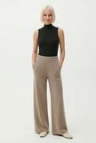 FJØRNA women's joggers, stylish and comfortable pants for women, shown in a casual outfit on a model.