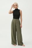 Women’s knit wide-leg trousers with elastic waist, stylish and comfortable pants from FJØRNA, shown in a casual outfit.