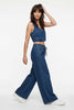 Blue denim wide-leg drawstring pants for women by FJØRNA, relaxed fit, casual style, shown on a model.