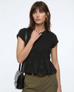FJØRNA women’s linen ruched ruffle top with casual, relaxed fit and textured fabric, featuring ruffle details on the neckline.