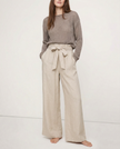 FJØRNA linen wide-leg loose pull-on women's trousers, showing soft fabric and relaxed fit on model in natural light.