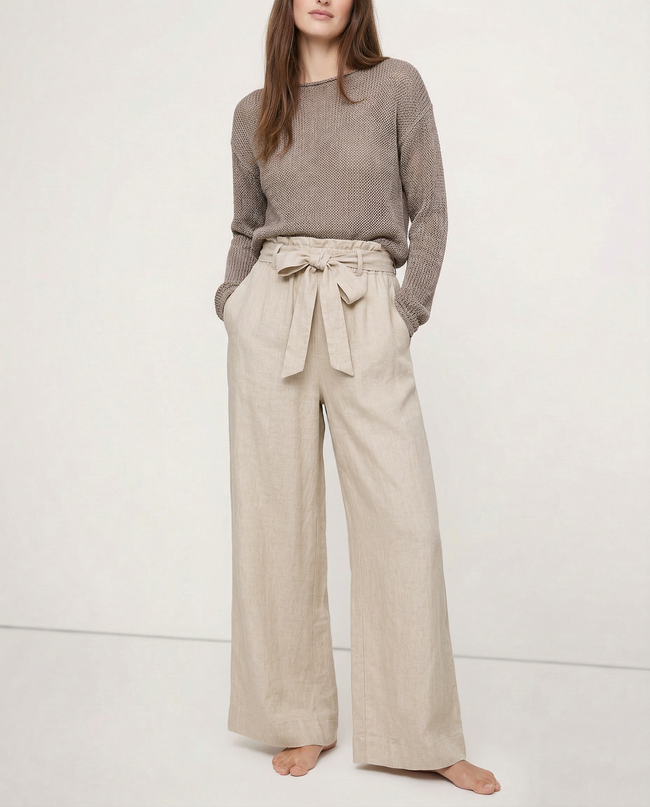 FJØRNA linen wide-leg loose pull-on women's trousers, showing soft fabric and relaxed fit on model in natural light.