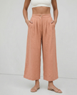 FJØRNA linen cropped culotte trousers for women, wide-leg linen pants showing breathable fabric and relaxed fit.
