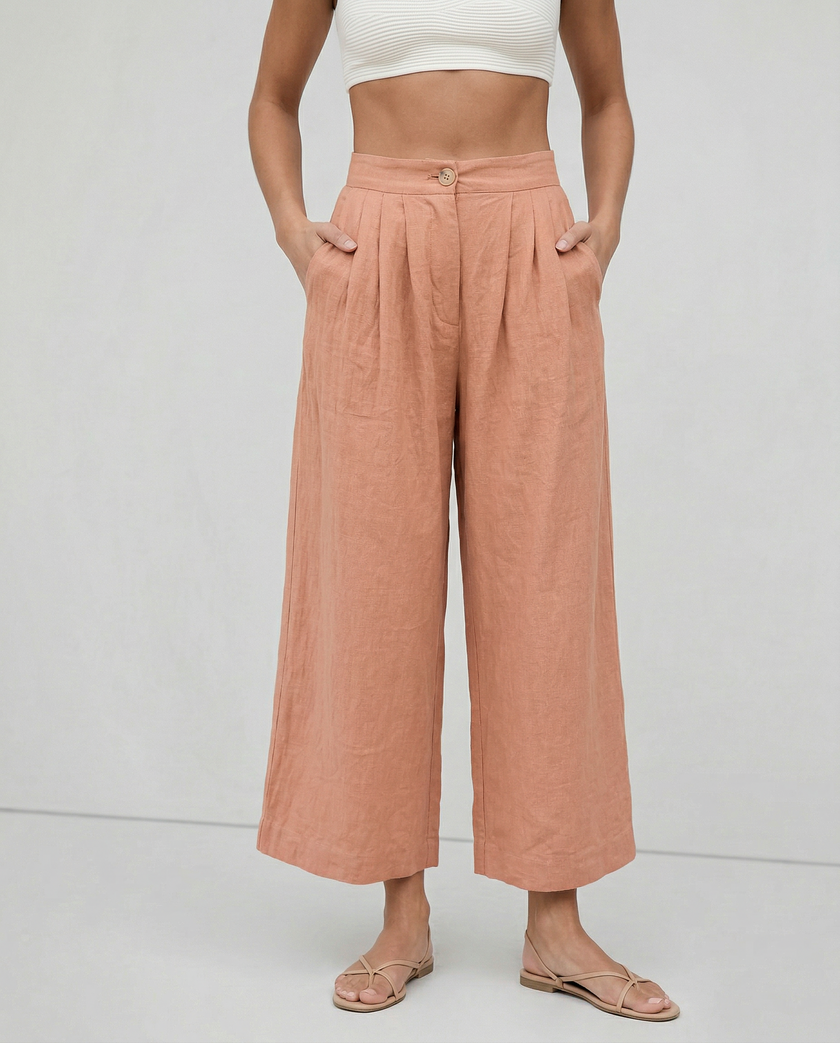 FJØRNA linen cropped culotte trousers for women, wide-leg linen pants showing breathable fabric and relaxed fit.