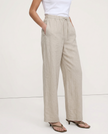 FJØRNA women's knit wide-leg trousers with drawstring waist, showcasing soft fabric and relaxed fit in a natural pose.