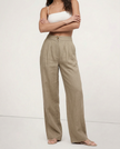 FJØRNA women's linen cropped culotte trousers with wide-leg design, showcasing lightweight, textured linen fabric.