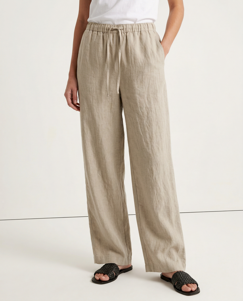 FJØRNA women's knit wide-leg trousers with drawstring waist, showcasing soft fabric and relaxed fit for comfortable style.