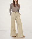 FJØRNA linen wide-leg pull-on trousers for women, showcasing soft fabric quality and relaxed, loose fit style.