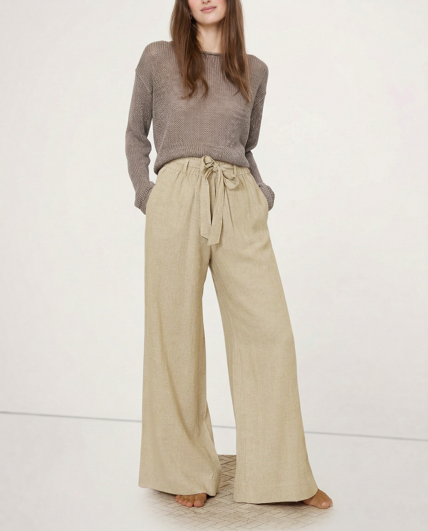 FJØRNA linen wide-leg pull-on trousers for women, showcasing soft fabric quality and relaxed, loose fit style.