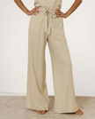 FJØRNA linen wide-leg pull-on trousers for women, showcasing soft fabric and relaxed fit in a natural pose.