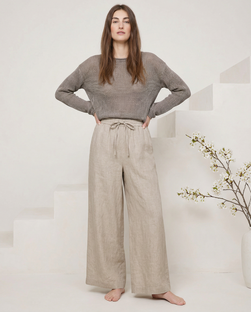 FJØRNA linen wide-leg women’s trousers in a loose pull-on style, showcasing soft, high-quality fabric and relaxed fit.
