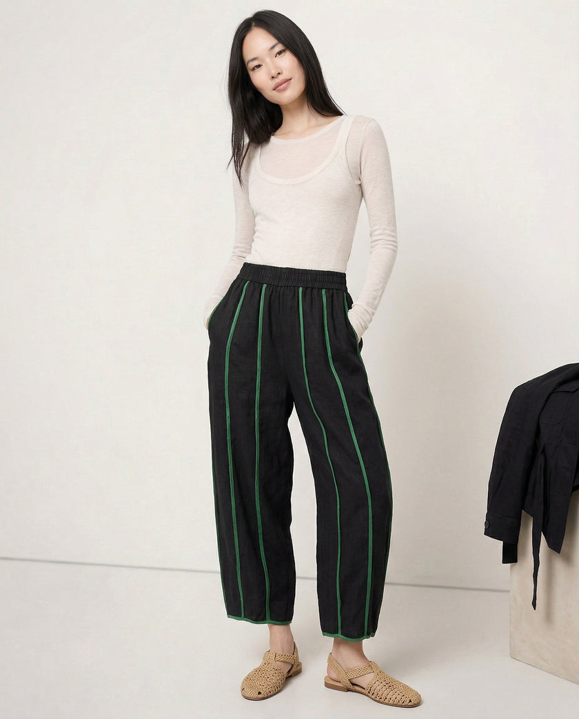 FJØRNA linen wide leg women's trousers with elastic waist, showing high-quality linen fabric and relaxed fit.