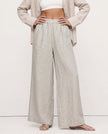 FJØRNA linen wide-leg trousers for women with drawstring pull-on design, showing high-quality, breathable linen fabric.