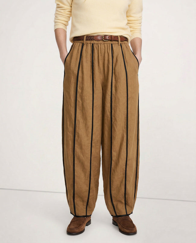 FJØRNA women's linen wide-leg trousers with elastic waist, showcasing high-quality, realistic linen fabric and relaxed fit.