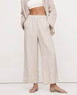 FJØRNA linen wide-leg trousers for women with drawstring pull-on design, showing high-quality, realistic linen fabric.