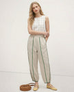 FJØRNA linen wide-leg women's trousers with elastic waist, showcasing high-quality, realistic linen fabric and comfortable fit.