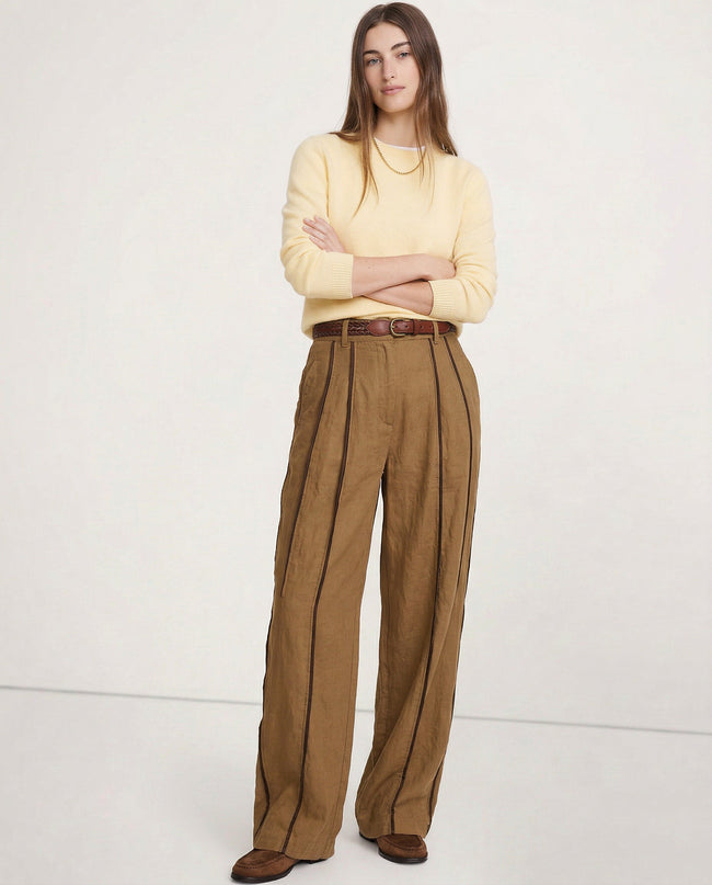 FJØRNA women's linen wide-leg trousers with elastic waist, showcasing soft, high-quality linen fabric and relaxed fit.