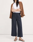 FJØRNA linen wide-leg women's trousers with drawstring, showcasing soft, high-quality linen fabric and relaxed fit.
