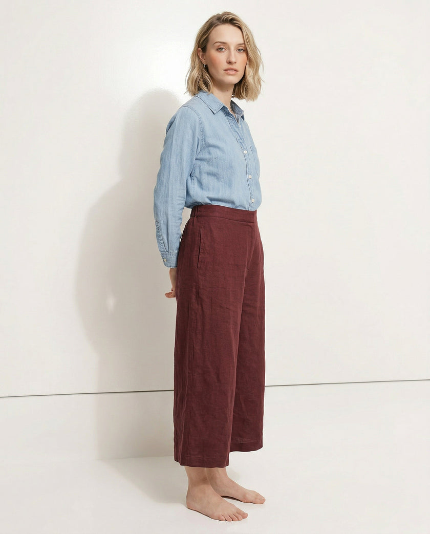 FJØRNA linen wide leg women’s trousers with drawstring, showing high-quality linen fabric and relaxed fit on a neutral background.