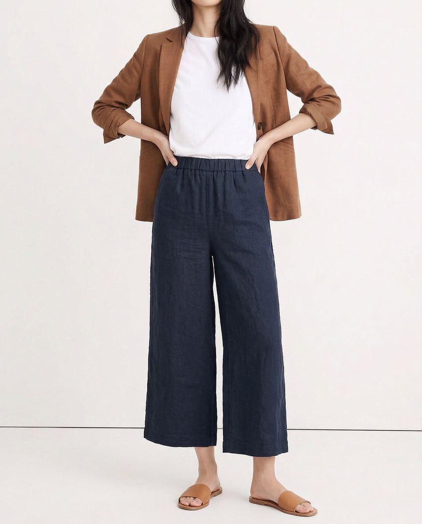 FJØRNA linen wide-leg women’s trousers with drawstring, showcasing high-quality, realistic linen fabric and relaxed fit.