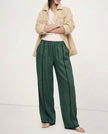 FJØRNA linen wide leg women's trousers with elastic waist, showcasing high-quality, realistic linen fabric and stylish fit.