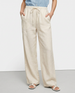 FJØRNA women's knit wide-leg trousers with drawstring, showing soft fabric texture and relaxed fit.