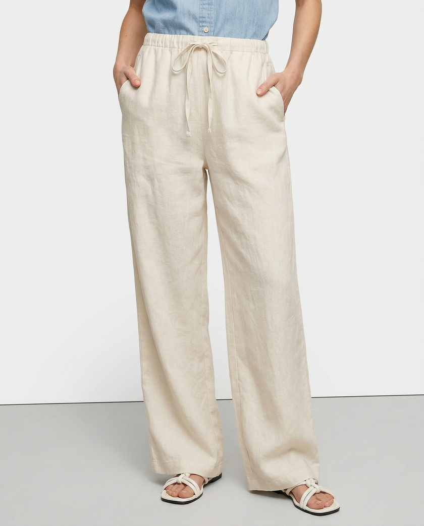 FJØRNA women's knit wide-leg trousers with drawstring, showing soft fabric texture and relaxed fit.