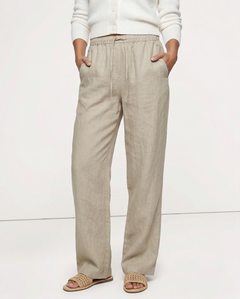 FJØRNA women's knit wide leg trousers with drawstring waist, styled for a relaxed, comfortable look.