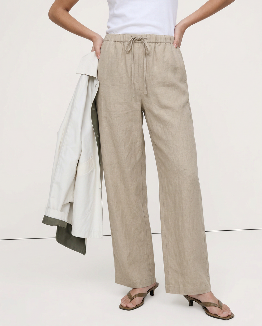 FJØRNA women's knit wide-leg trousers with drawstring waist, styled on a model showcasing relaxed, comfortable pants.