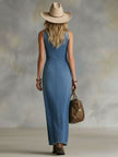 FJØRNA denim V-neck maxi dress with button details, flowing style, and long length, designed for women.