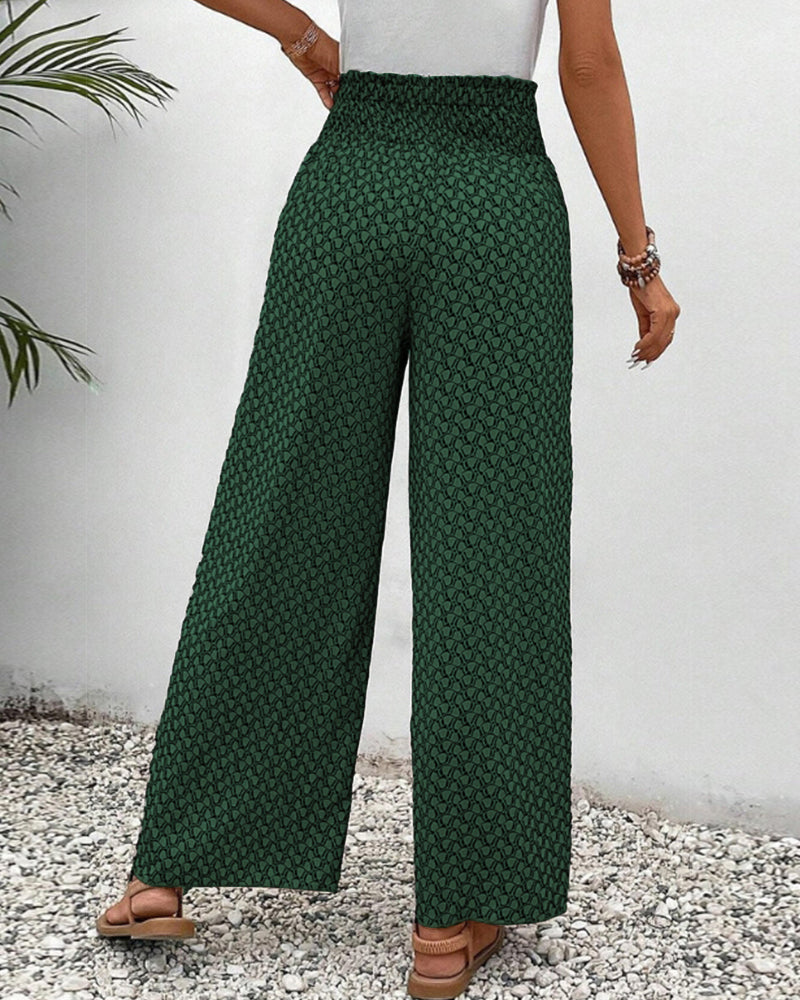 Green FJØRNA women's lightweight summer trousers with wide leg design, breathable fabric, ideal for warm weather.