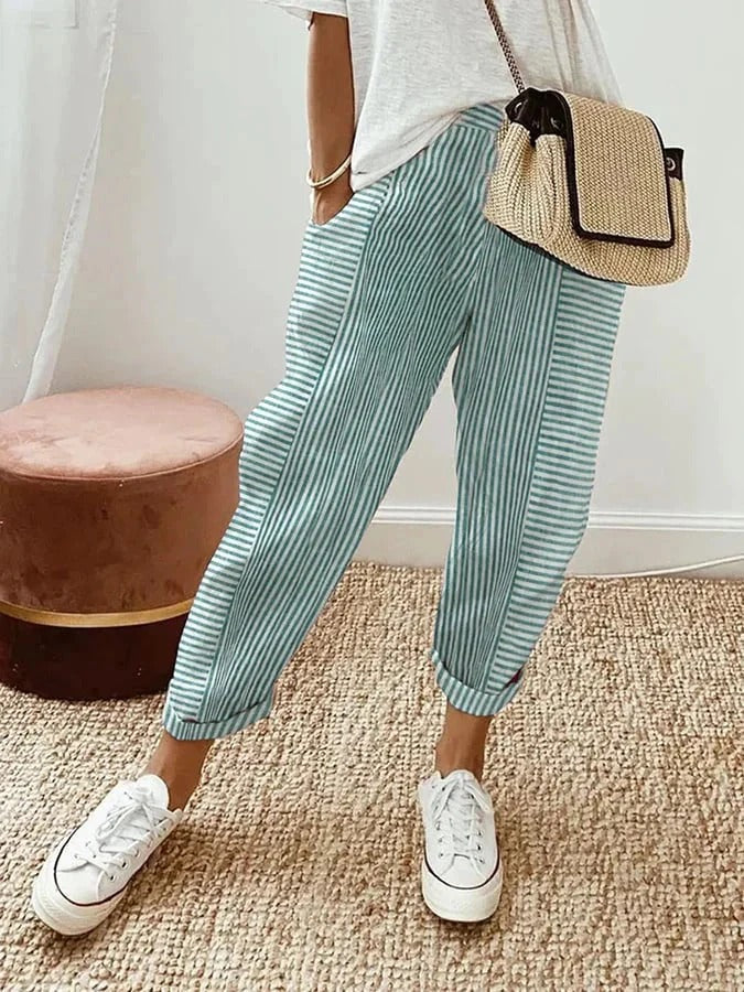 Green lightweight summer trousers for women by FJØRNA, straight leg style with drawstring waist, casual and comfortable fit.
