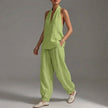 Green FJØRNA women's two-piece co-ord set with pockets and V-neck, perfect for summer casual wear, shown on a model.