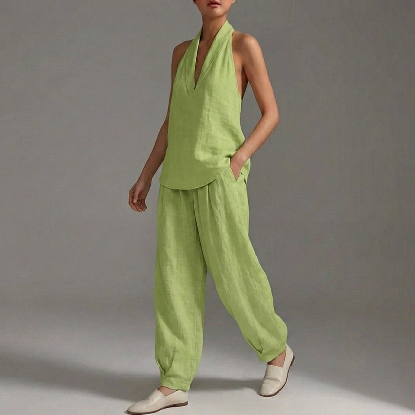 Green FJØRNA women's two-piece co-ord set with pockets and V-neck, perfect for summer casual wear, shown on a model.