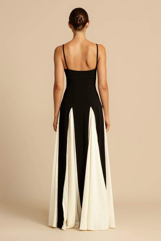 FJØRNA Griselda color block maxi slip dress in white with black accents, sleeveless design, flowing fabric, and V-neck style.