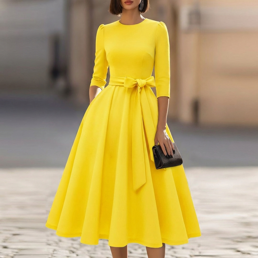 FJØRNA crew-neck A-line midi dress for wedding guests, elegant midi dress with a fitted waist and flowing skirt, in soft fabric.
