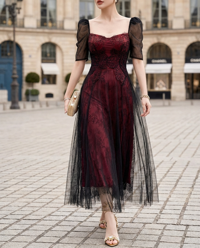 FJØRNA sheer puff-sleeve lace A-line midi dress featuring delicate lace fabric and elegant puff sleeves, full-length on model.