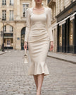 White pearl-trim square-neck mermaid midi dress by FJØRNA, featuring a fitted silhouette and elegant design.
