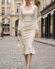 White pearl-trim square-neck mermaid midi dress by FJØRNA, featuring a fitted silhouette and elegant design.