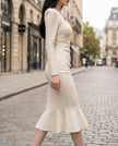 White pearl-trim square-neck mermaid midi dress by FJØRNA, showcasing elegant fit and intricate pearl details.