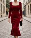 White pearl-trim square-neck mermaid midi dress by FJØRNA, showing the fitted silhouette and elegant neckline with pearl embellishments.