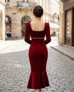 White pearl-trim square-neck mermaid midi dress by FJØRNA, showcasing fitted silhouette and elegant neckline with pearl accents.