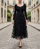 Black 3D floral embroidered mesh knit midi dress by FJØRNA, featuring intricate floral embroidery and a fitted silhouette.