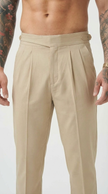 Men's tailored cream trousers by FJØRNA, featuring a slim fit and classic style, shown on a model in a casual setting.