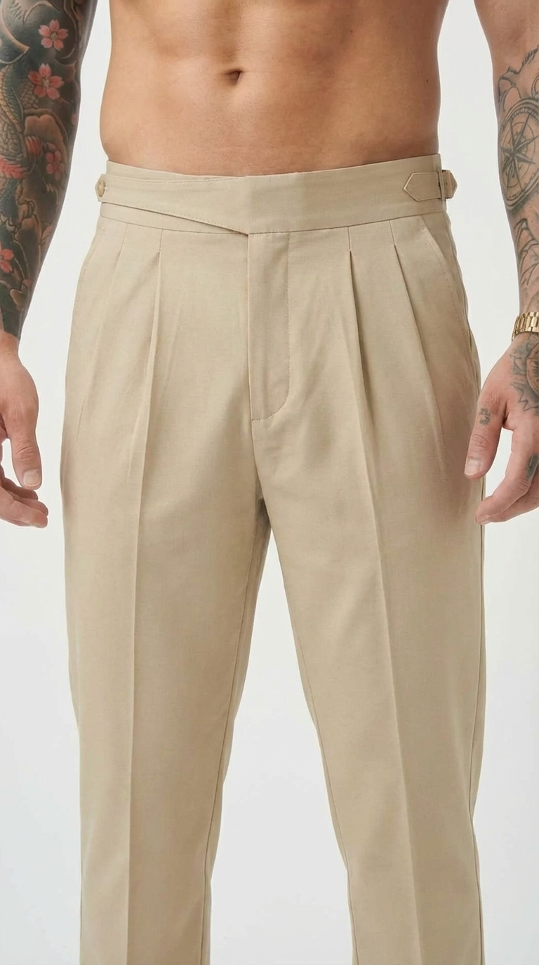 Men's tailored cream trousers by FJØRNA, featuring a slim fit and classic style, shown on a model in a casual setting.