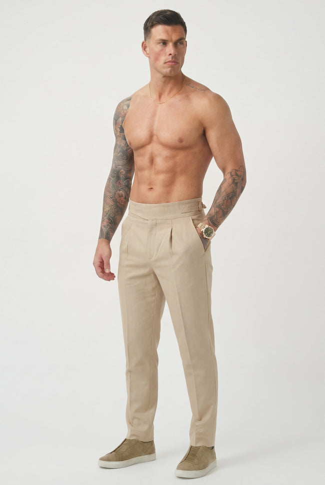 Men's tailored cream trousers by FJØRNA, featuring a slim fit and classic design, shown on a neutral background.